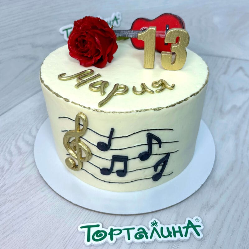 торт на день рождение девочки музыканта с фигуркой гитары и цветочком из мастики